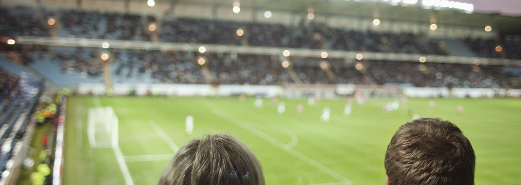 Image of rear-view-of-people-watching-soccer-match-at-stadi-2023-11-27-05-30-50-utc